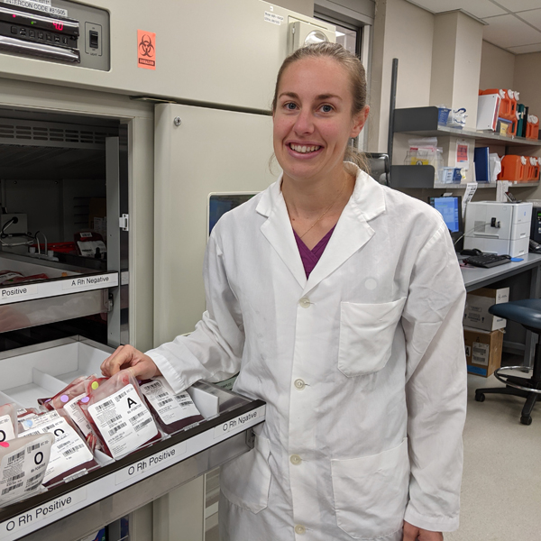 Image of medical laboratory technologist Michelle Dunn holding a blood bag in the lab