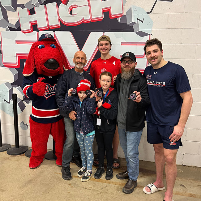 Ralph with Regina Pats mascot at a hockey game