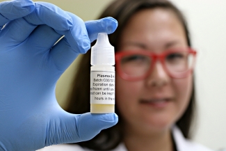 Image of Tamiko holding plasma eye drops.