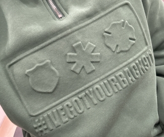 Green hoodie that says "I've got your back 911"