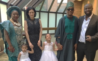 Akintunde and Firi Adeniyi pose with Akintunde’s brother and his family at their wedding reception in Ottawa. Akintunde and Firi both enjoy wearing their native Nigeria attire as in this photo.