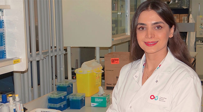 Mahsa Yazdanbakhsh in a white Canadian Blood Services lab coat
