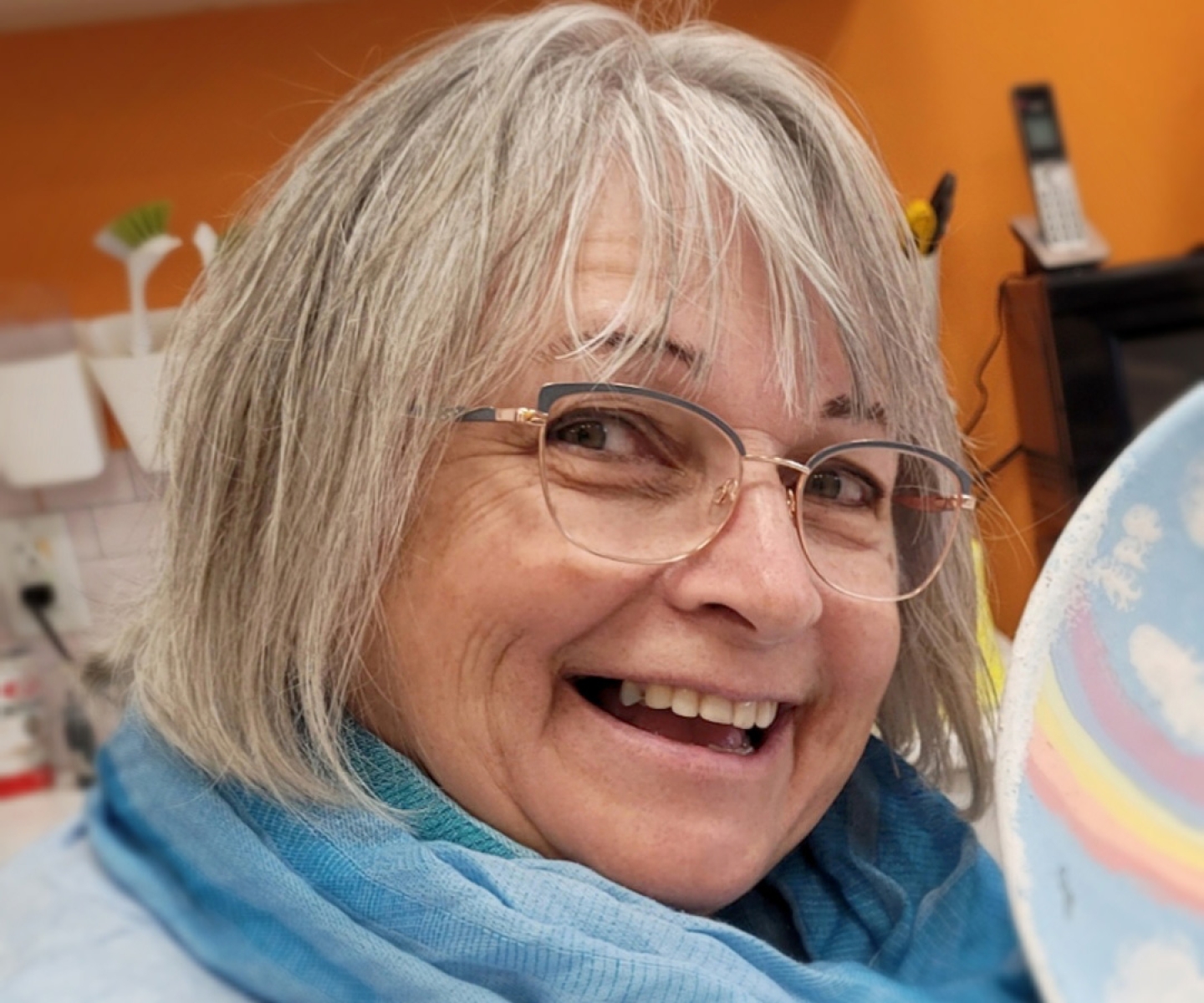 Blood donor wearing blue scarf
