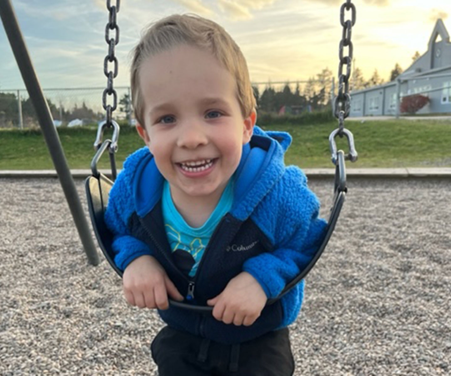 Colton Burns on a swing at the play structure