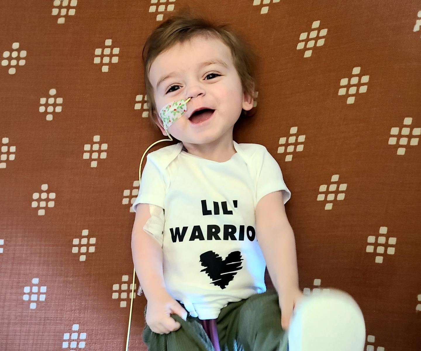Child heart recipient wearing Lil Warrior T-shirt