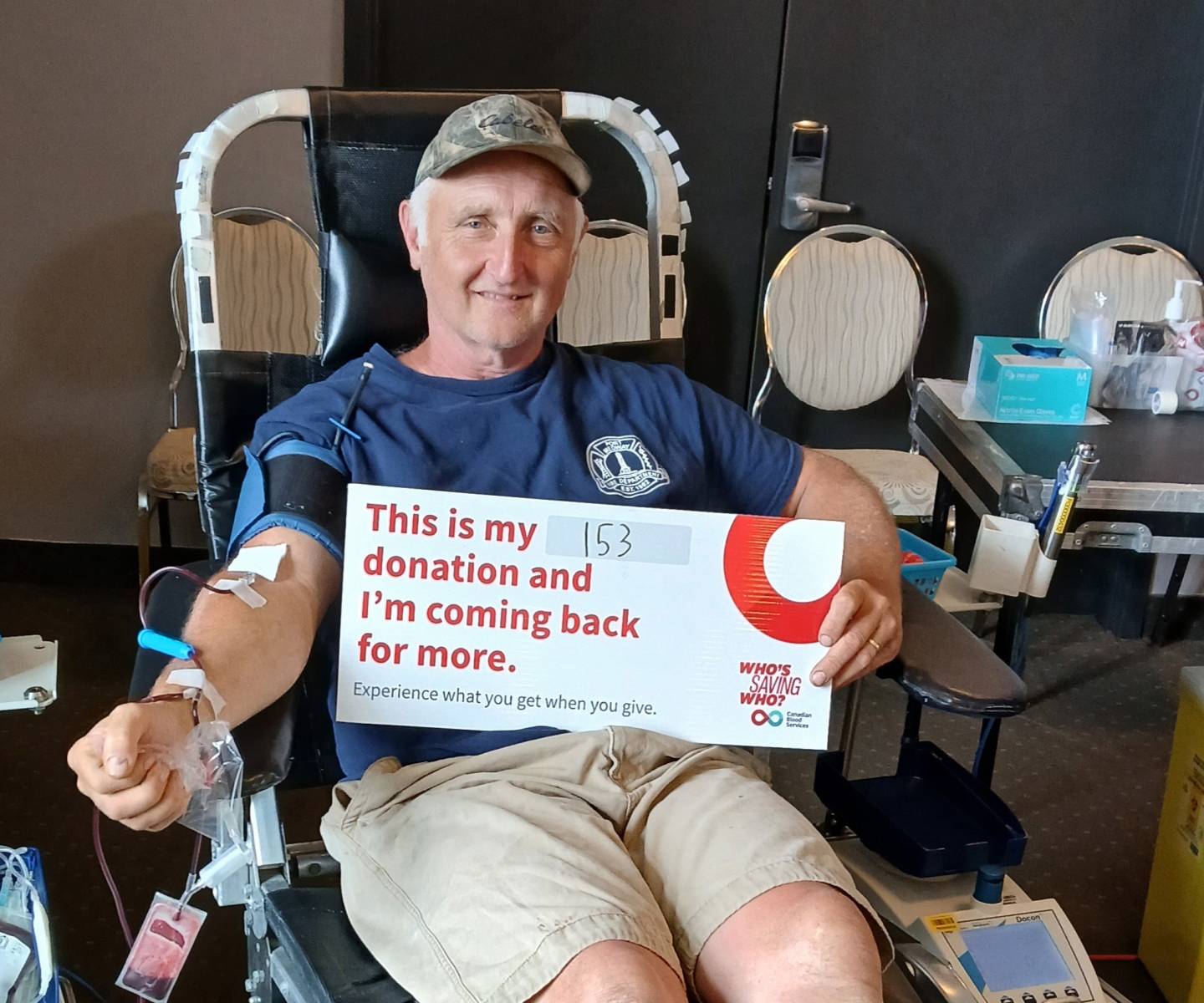 Blood donor holding sign for blood donation 153