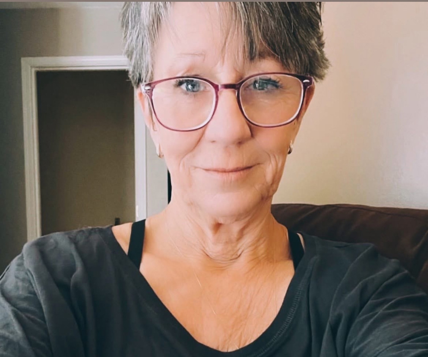 Blood donor in black shirt and glasses