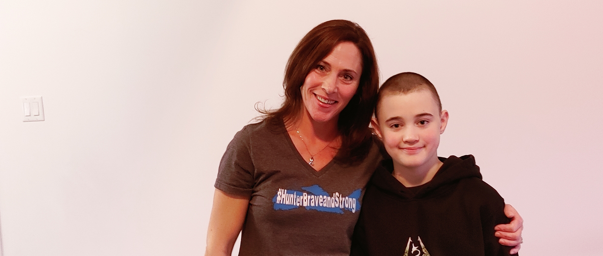 A young cancer patient with his mother 