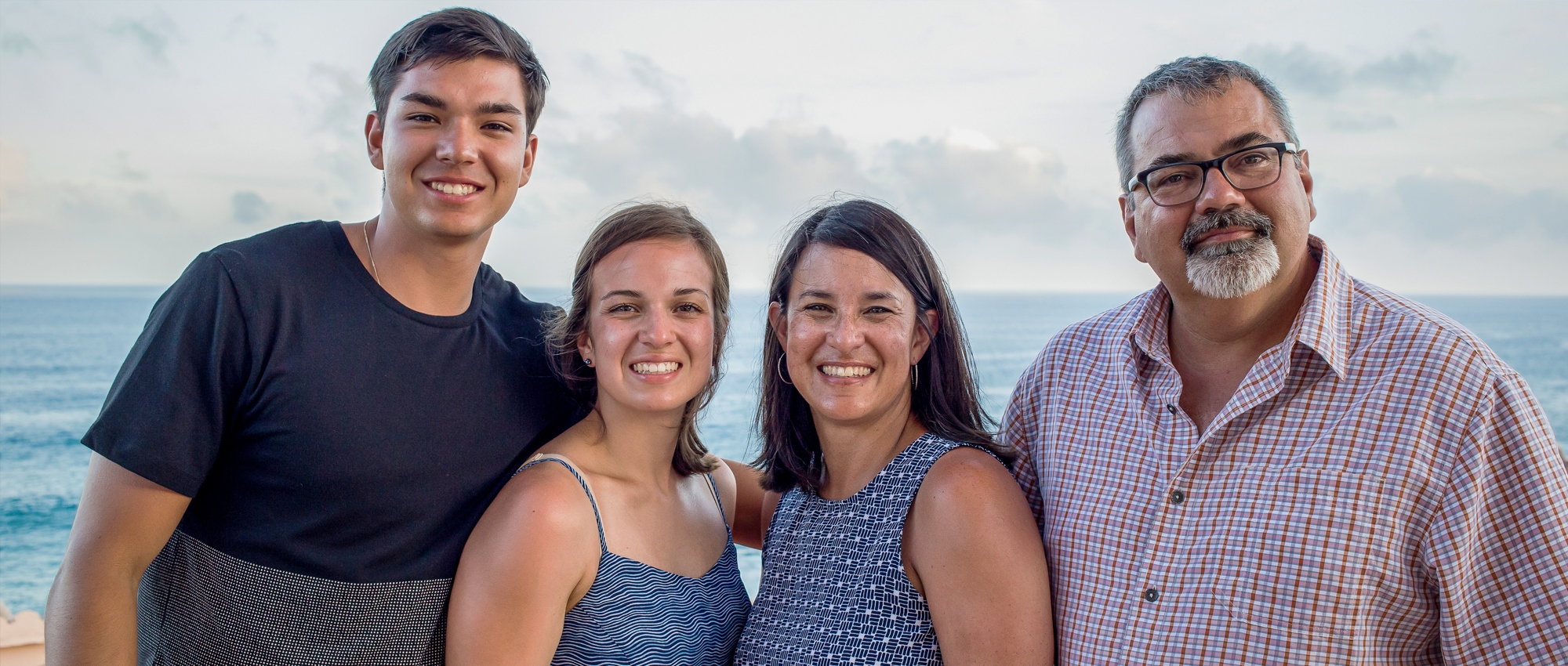 Logan Boulet with his family at a beach during a vacation.