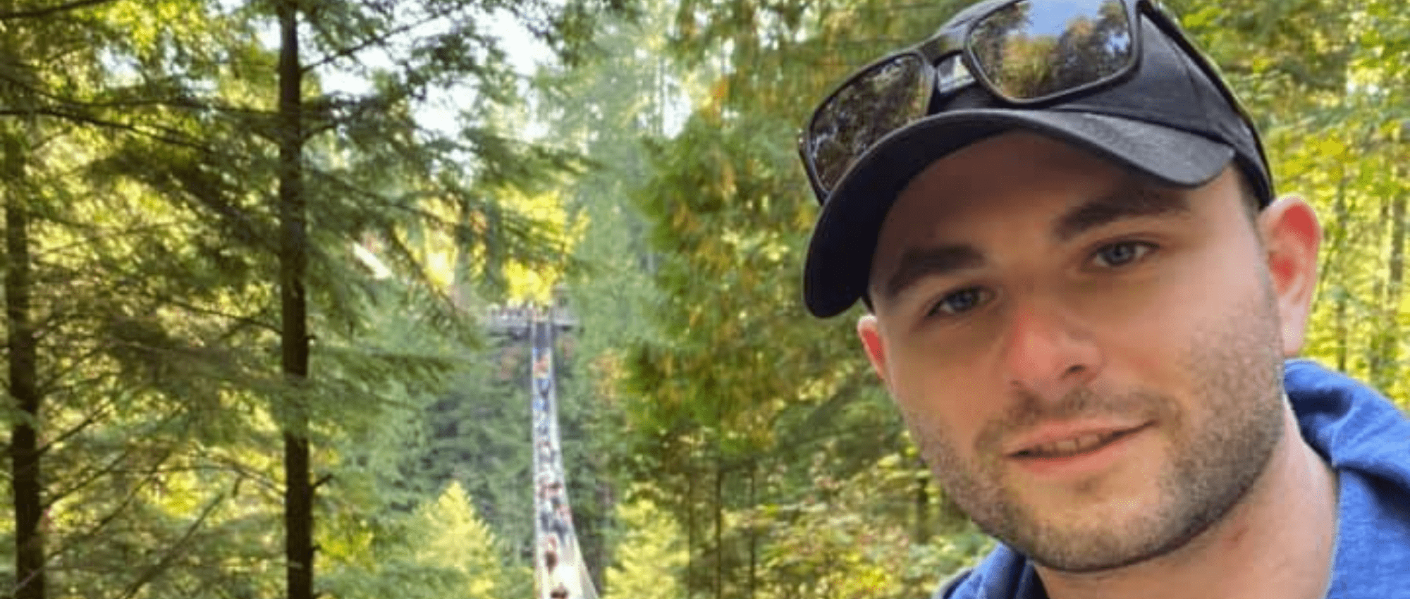 Blood recipient, Ben Becker, on suspension bridge in forest 