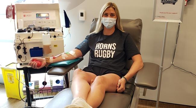 A student donating plasma at the Lethbridge plasma donor centre 