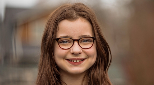 Young girl looking at camera